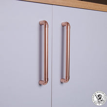 Load image into Gallery viewer, Copper Pull Cabinet Handles Made Using Copper Pipe And Fittings On Light Grey Kitchen Doors.